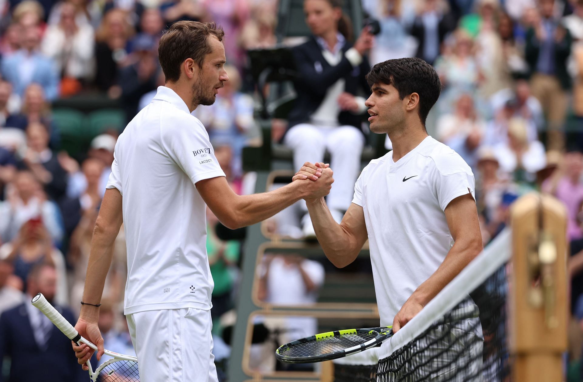 Daniil Medvedev and Carlos Alcaraz at The Championships - Wimbledon 2024.